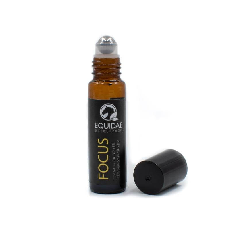 Row of equine essential oils on shelf by Equidae Botanical Horse Care