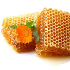 Honey and other ingredients being mixed into natural ointment for horse wounds.